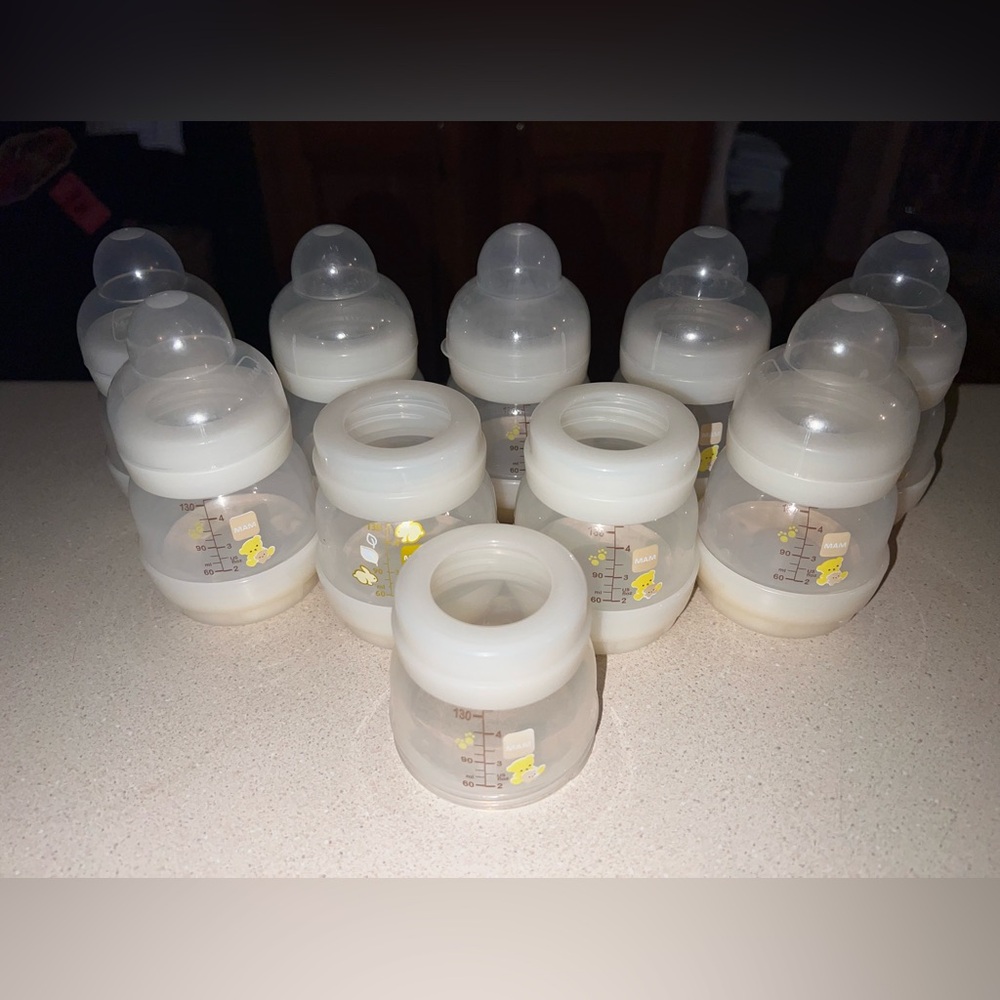 9- 4 oz. bottles 2 caps are missing 1 extra body and ring